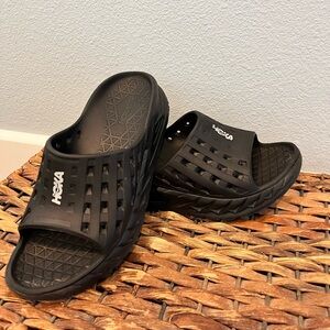 Women’s size 8 Hoka recovery slides.